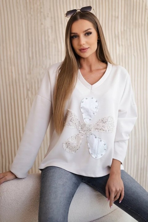 Bluza masełko z ozdobnym kwiatem beżowa uniwersalny Bluza masełko z ozdobnym kwiatem beżowa uniwersalny